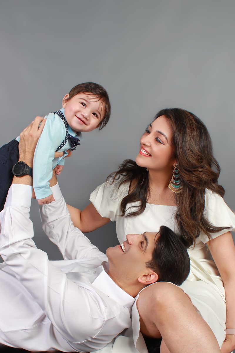 Parents lifting their baby during a family session