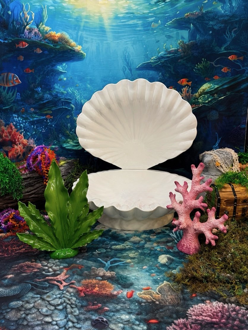 The mermaid set at Atlanta Portrait Studio, a giant clam shell surrounded by coral and a treasure chest